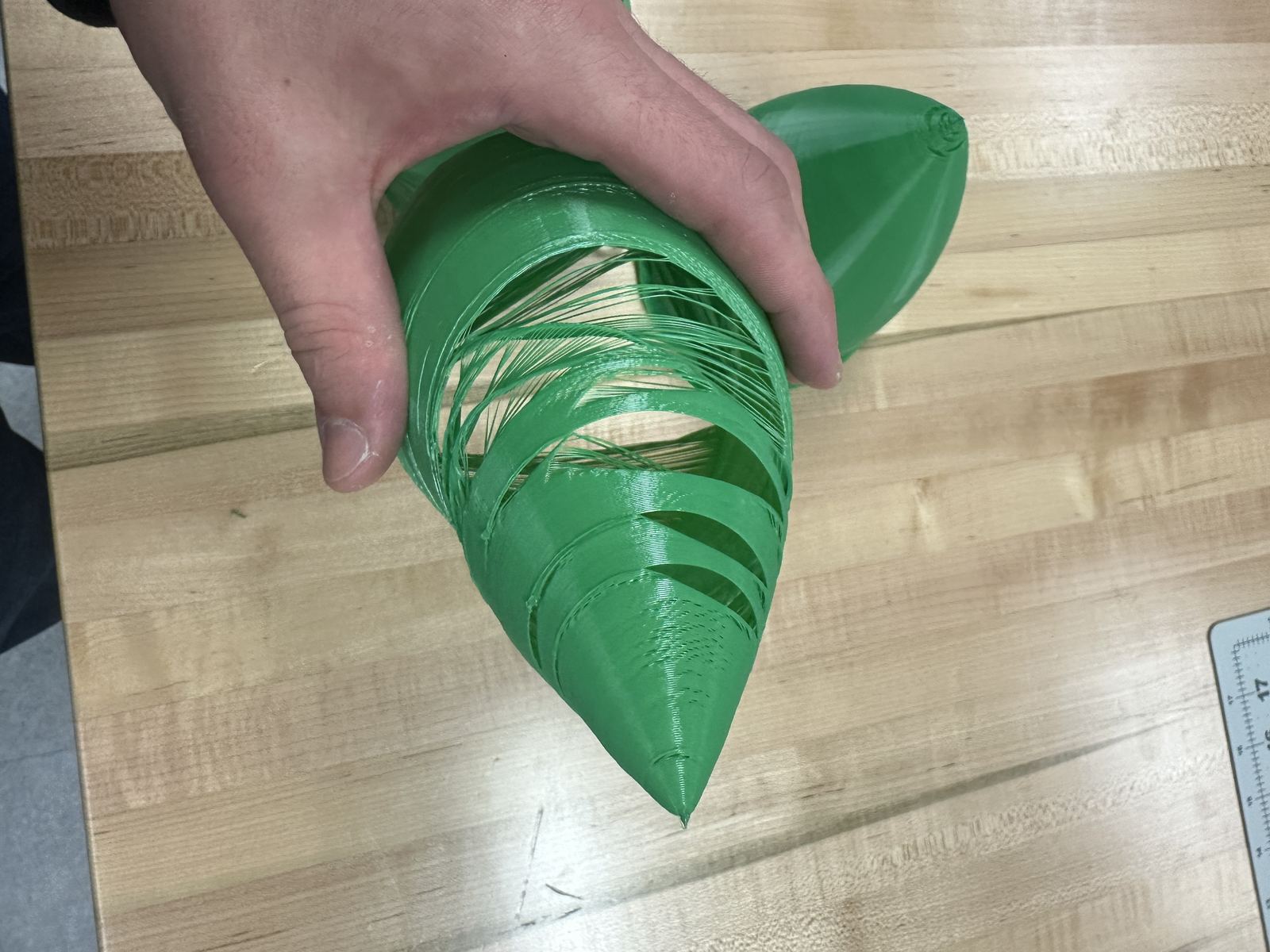 Failed nose cone print top view showing deformation near the tip